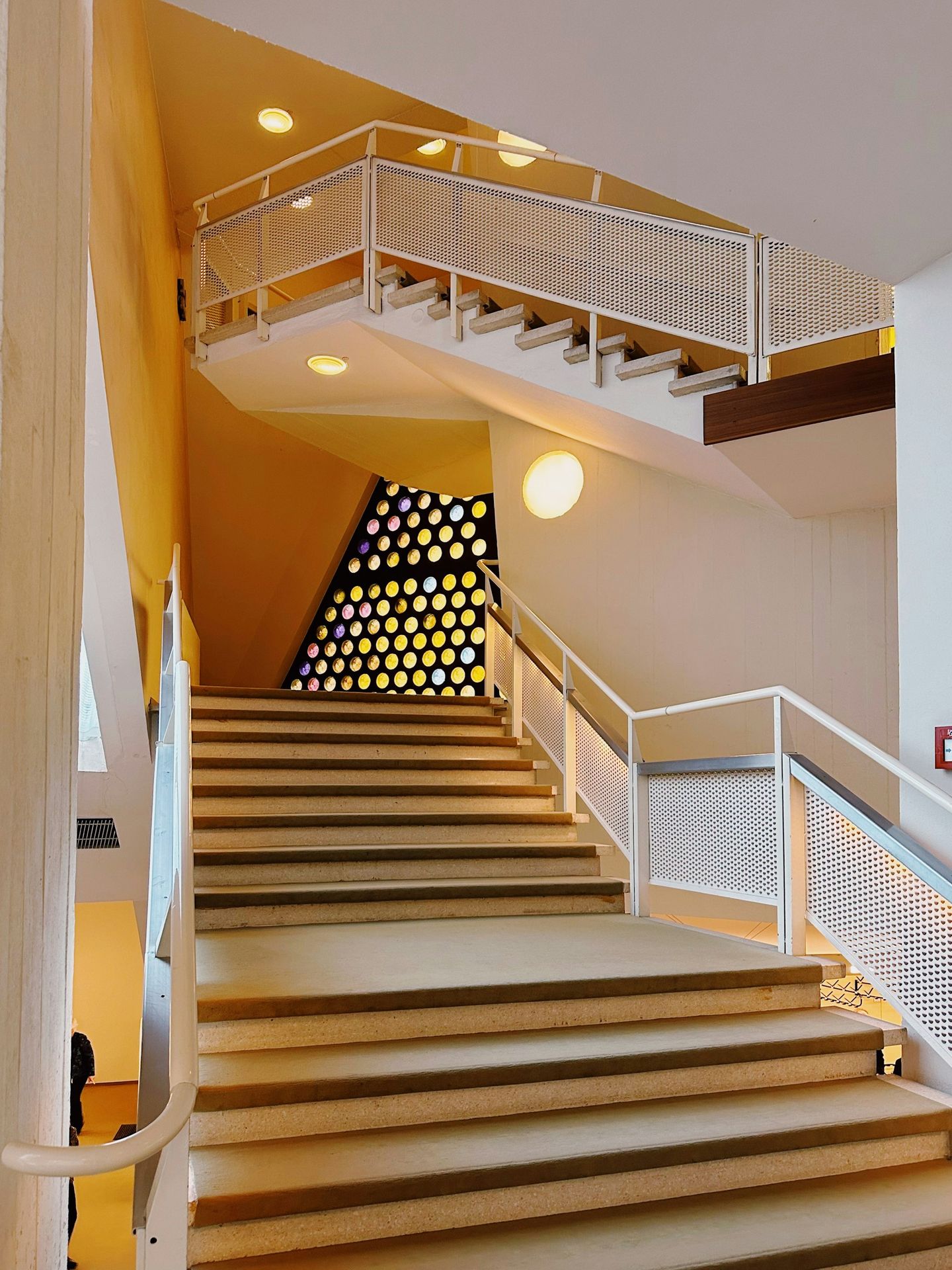 a staircase leading up to the top floor of a building